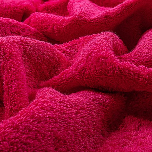 Toalla de baño fucsia lisa de algodón 100%