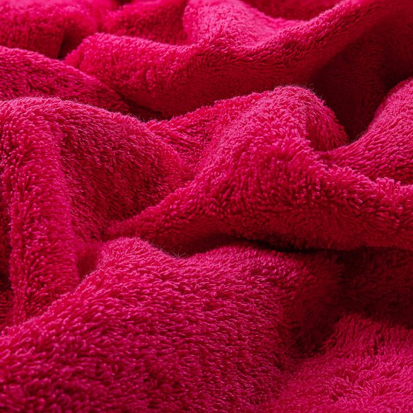 Toalla de baño fucsia lisa de algodón 100%