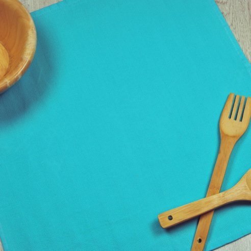 Torchon de cuisine bleu turquoise en tissu 100 % coton.
